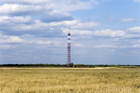 simsearch:400-08997106,k - a lone communications tower on field with cloudy sky background Stock Photo - Budget Royalty-Free & Subscription, Code: 400-04633394