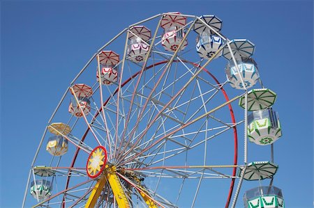 A Ferris wheel without passengers against clear blue sky. Stock Photo - Budget Royalty-Free & Subscription, Code: 400-04633559