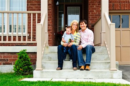 father child yard not illustration not business not vintage not 20s not 30s not 40s not 70s not 80s - Young family sitting on front steps of house Stock Photo - Budget Royalty-Free & Subscription, Code: 400-04633771