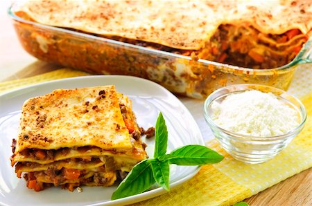 Fresh baked lasagna casserole with a serving cut Stock Photo - Budget Royalty-Free & Subscription, Code: 400-04633792