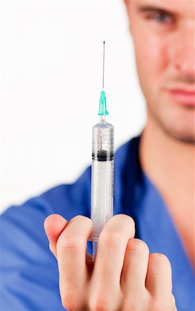 simsearch:400-06553842,k - Close-up of an attractive doctor holding an injection Stockbilder - Microstock & Abonnement, Bildnummer: 400-04633829