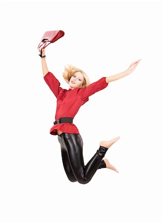 Jumping woman in red top and black leggins over white isolated background Stock Photo - Budget Royalty-Free & Subscription, Code: 400-04644574