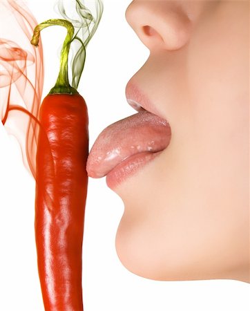 simsearch:400-07899696,k - girl close up licking chili pepper  isolated on white Photographie de stock - Aubaine LD & Abonnement, Code: 400-04644671