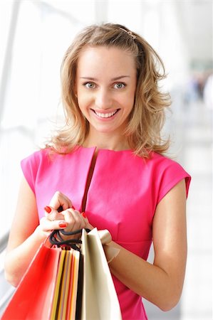 simsearch:400-07318724,k - Woman with bags in shopping mall Fotografie stock - Microstock e Abbonamento, Codice: 400-04645187