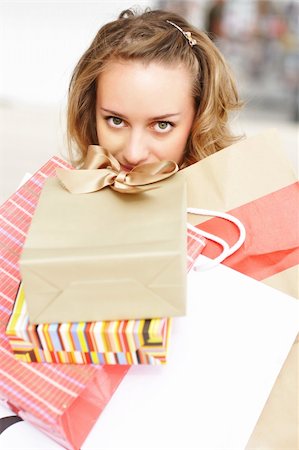simsearch:400-07318724,k - Woman with bags in shopping mall Fotografie stock - Microstock e Abbonamento, Codice: 400-04645194