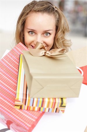 simsearch:400-07318724,k - Woman with bags in shopping mall Fotografie stock - Microstock e Abbonamento, Codice: 400-04645193