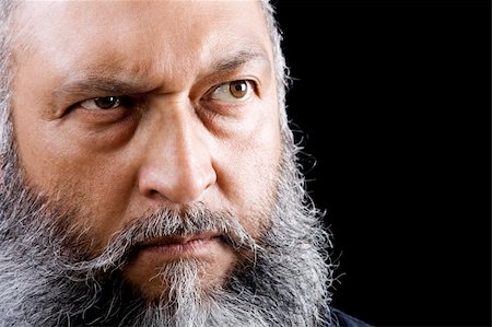 Stock image of menacing man with long beard over dark background Photographie de stock - Aubaine LD & Abonnement, Code: 400-04645321