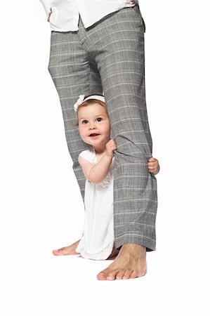 family values - Happy baby at fathers legs isolated on a white background Photographie de stock - Aubaine LD & Abonnement, Code: 400-04645801