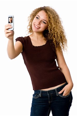 eastwestimaging (artist) - A young woman taking her self-portrait with a camera phone Fotografie stock - Microstock e Abbonamento, Codice: 400-04646221
