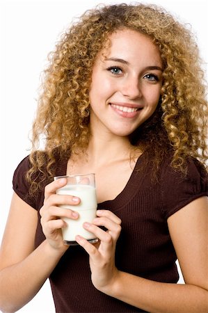 eastwestimaging (artist) - A young woman holding a glass of milk on white background Fotografie stock - Microstock e Abbonamento, Codice: 400-04646248