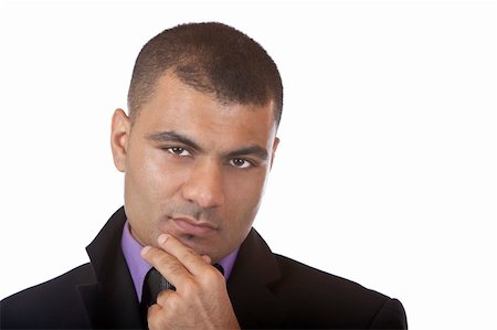 simsearch:400-03996768,k - Closeup of businessman which looks contemplative into camera. Isolated on white background. Stock Photo - Budget Royalty-Free & Subscription, Code: 400-04647067