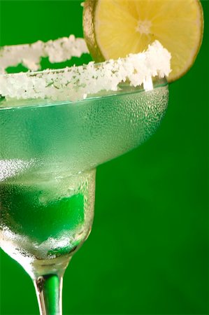 Close up of a cold Margarita glass rimmed with salt and wedged with lime Stock Photo - Budget Royalty-Free & Subscription, Code: 400-04647125