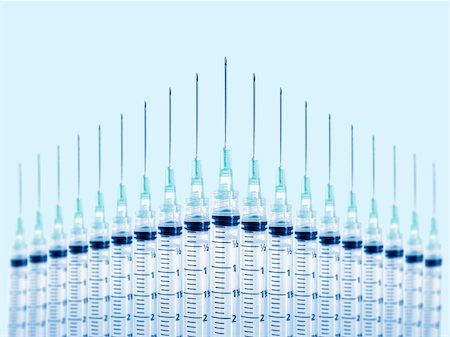 Stock image of syringes in formation. Focus on front syringe. Stockbilder - Microstock & Abonnement, Bildnummer: 400-04647745