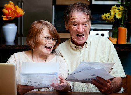 simsearch:400-04744719,k - Senior couple at home reacting to many bills Stock Photo - Budget Royalty-Free & Subscription, Code: 400-04647955