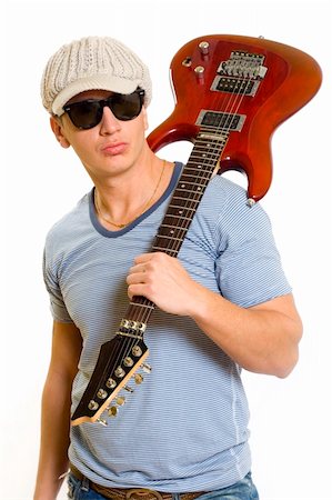 simsearch:400-04165972,k - guitarist with electric guitar on his shoulder over white background Stock Photo - Budget Royalty-Free & Subscription, Code: 400-04648060