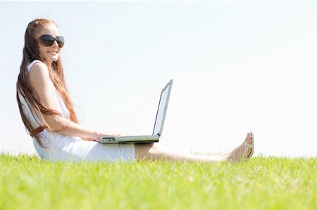 simsearch:6109-06003526,k - A cute young female sit on the grass in the park using a laptop Stock Photo - Budget Royalty-Free & Subscription, Code: 400-04648264