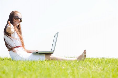 simsearch:6109-06003526,k - A cute young female sit on the grass in the park using a laptop Stock Photo - Budget Royalty-Free & Subscription, Code: 400-04648265