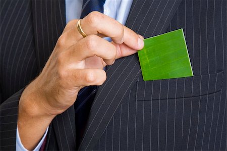 simsearch:400-04648812,k - Man giving out a green business card Stock Photo - Budget Royalty-Free & Subscription, Code: 400-04648441