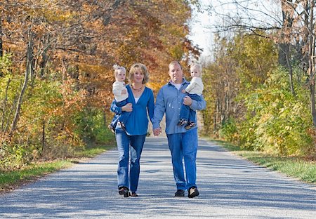 Family Taking a Walk in the Autumn Stock Photo - Budget Royalty-Free & Subscription, Code: 400-04648600