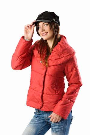 studio shot of a young brunette with a red windbreaker jacket and a nice black cap Stock Photo - Budget Royalty-Free & Subscription, Code: 400-04648776