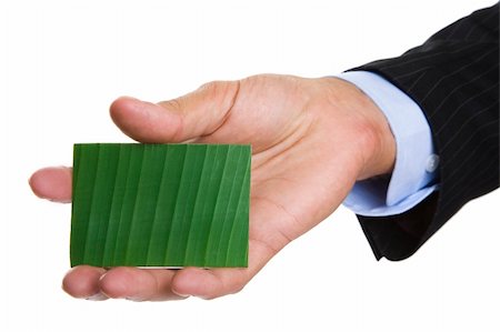 simsearch:400-04648812,k - Man giving out a green business card Stock Photo - Budget Royalty-Free & Subscription, Code: 400-04648813
