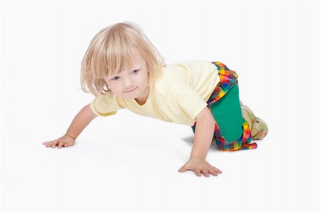 boy with long blond hair crawling on the floor - clipping path Stock Photo - Budget Royalty-Free & Subscription, Code: 400-04648856