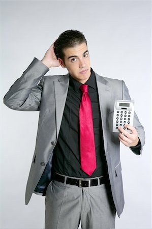 simsearch:400-05363701,k - Businessman formal suit bad number news reports calculator Stock Photo - Budget Royalty-Free & Subscription, Code: 400-04649186