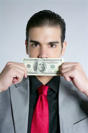 Businessman young with dollar notes suit and tie on gray background Stock Photo - Budget Royalty-Free & Subscription, Code: 400-04649189