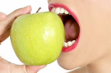 Apple macro on woman mouth detail of bite on white background Stock Photo - Budget Royalty-Free & Subscription, Code: 400-04649235
