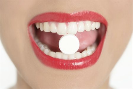 Beauty woman mouth with red lips and medicine pill Stock Photo - Budget Royalty-Free & Subscription, Code: 400-04649236