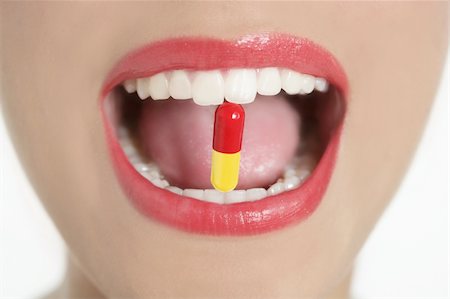 Beauty woman mouth with red lips and medicine pill Stock Photo - Budget Royalty-Free & Subscription, Code: 400-04649237