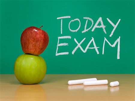 simsearch:400-05755412,k - Today exam written on a chalkboard. Some chalks and apples on the foreground. Photographie de stock - Aubaine LD & Abonnement, Code: 400-04640402