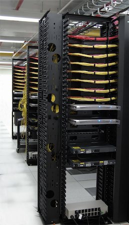 A data center where each row of servers has a KVM server control system mounted at the end of each row. Photographie de stock - Aubaine LD & Abonnement, Code: 400-04641130