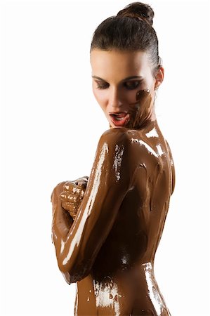 amazing shot of a young beautiful brunette with her naked body covered of sweet cream chocolate Stock Photo - Budget Royalty-Free & Subscription, Code: 400-04642022