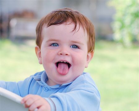 a smiling boy showing his tongue Stock Photo - Budget Royalty-Free & Subscription, Code: 400-04642107