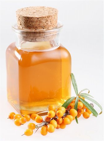 Sea buckthorn oil on a white background Foto de stock - Royalty-Free Super Valor e Assinatura, Número: 400-04642464