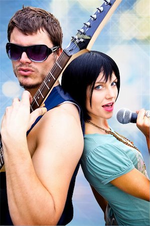 simsearch:693-03302042,k - Rock Band Performing Together back to back Stock Photo - Budget Royalty-Free & Subscription, Code: 400-04642640