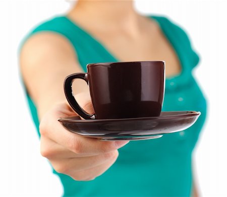 Waitress serving you a coffee. Iconic simple image. Isolated on white background. Shallow depth of field, focus on cup. Stock Photo - Budget Royalty-Free & Subscription, Code: 400-04642723