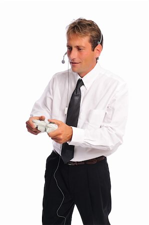 a business man playing video games on a white background Stock Photo - Budget Royalty-Free & Subscription, Code: 400-04642932