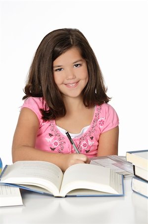 simsearch:400-04175049,k - Cute Caucasian girl working on homework Stock Photo - Budget Royalty-Free & Subscription, Code: 400-04643221