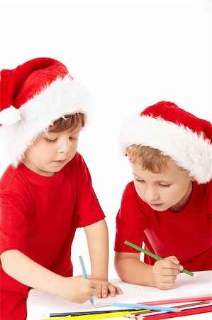 draw the winter season for kids - Two little boys in a hat of santa draw on sheet Stock Photo - Budget Royalty-Free & Subscription, Code: 400-04654331