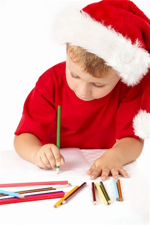 simsearch:400-09222788,k - Little boy in a suit of santa draws something, isolated Photographie de stock - Aubaine LD & Abonnement, Code: 400-04654333