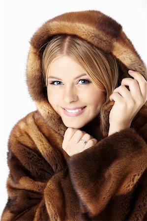 simsearch:400-04654369,k - Beautiful blonde muffles up in the brown fur coat, isolated Stock Photo - Budget Royalty-Free & Subscription, Code: 400-04654360