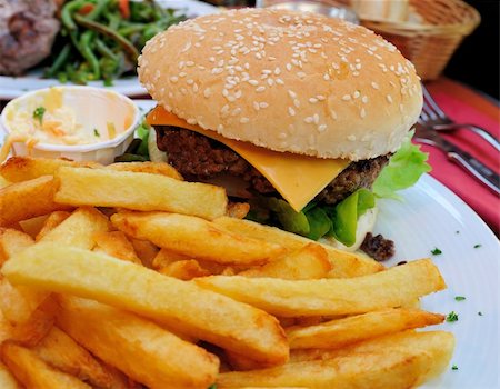 simsearch:400-05330097,k - Cheese burger - American cheese burger with fresh salad Stock Photo - Budget Royalty-Free & Subscription, Code: 400-04654633