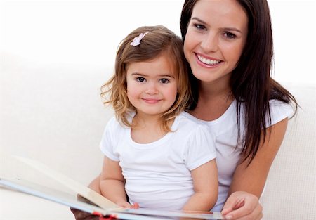simsearch:400-05749645,k - Portrait of mother and daughter reading a book in living-room Stock Photo - Budget Royalty-Free & Subscription, Code: 400-04654741