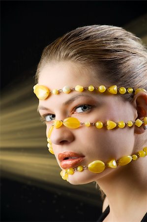simsearch:400-06103705,k - pretty young blond woman with a yellow stones necklace around her face Foto de stock - Super Valor sin royalties y Suscripción, Código: 400-04654984