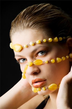 simsearch:400-06103705,k - beauty shot close up of a pretty young blond woman with a yellow stones necklace around her face Foto de stock - Super Valor sin royalties y Suscripción, Código: 400-04654983