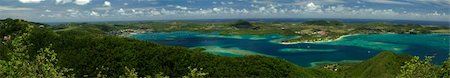 sugar beach - Panorama of the bay and  the sailboat harbour Foto de stock - Super Valor sin royalties y Suscripción, Código: 400-04654993