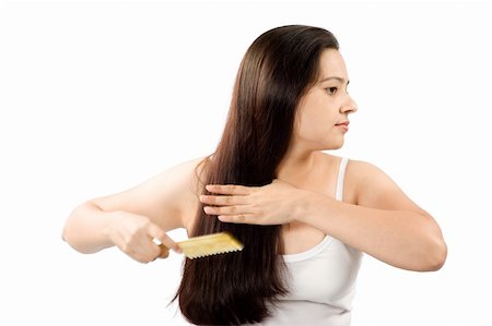 Bright picture of combing beautiful woman with long hair over white Foto de stock - Super Valor sin royalties y Suscripción, Código: 400-04655560