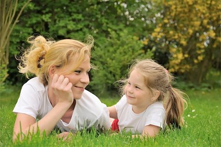 simsearch:400-04795754,k - Young mother and daughter laying on the grass Stock Photo - Budget Royalty-Free & Subscription, Code: 400-04656130